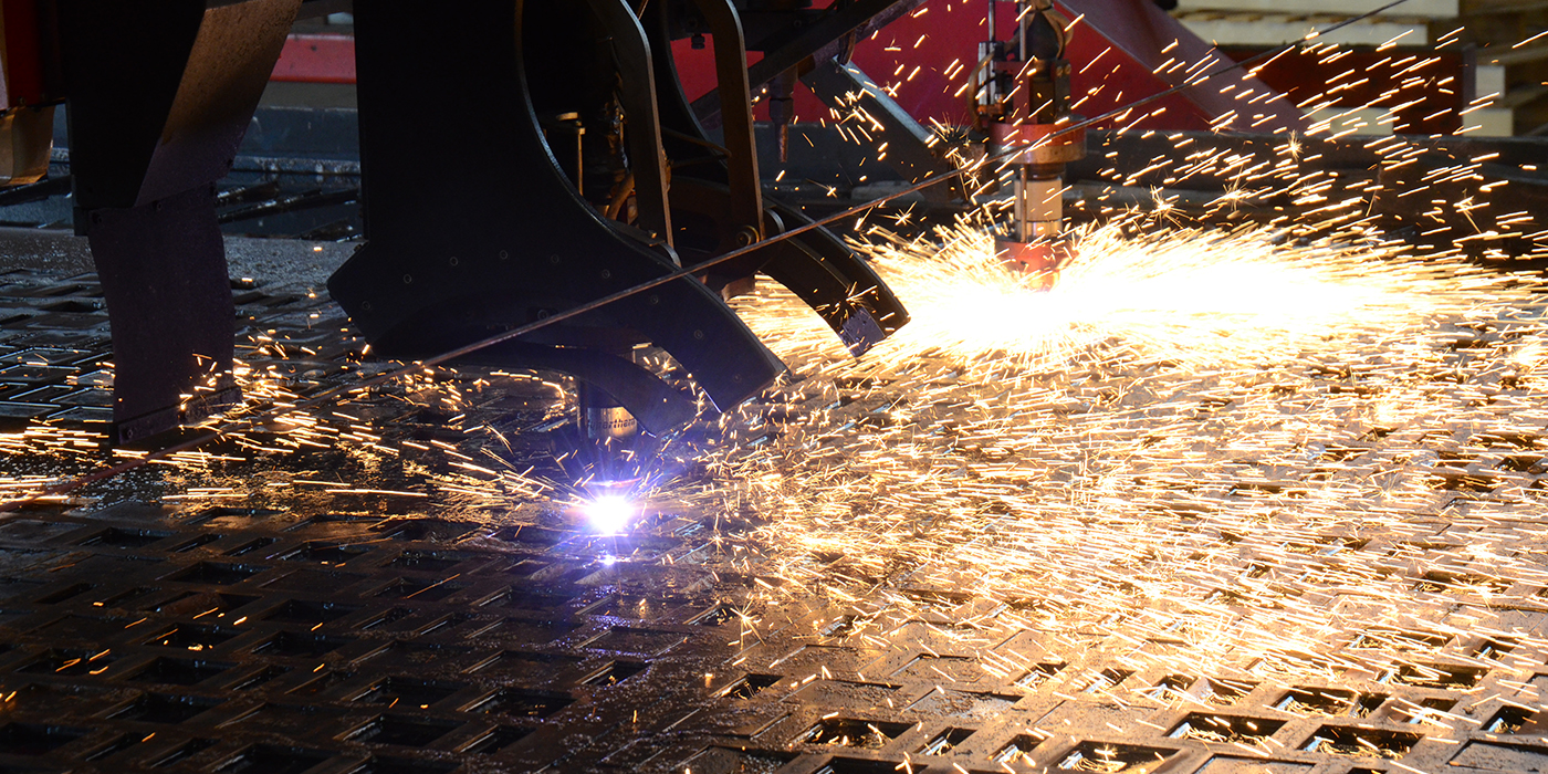 Kinetic Cutting System cutting holes in a punch plate